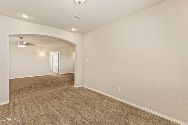 14840 Tim Hardaway, El Paso, TX 79938 - spare room with arched walkways, carpet floors, baseboards, and ceiling fan