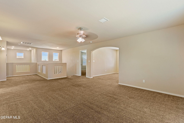 14840 Tim Hardaway, El Paso, TX 79938 - carpeted spare room featuring ceiling fan, arched walkways, and baseboards