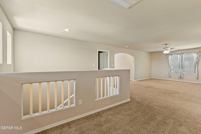 14840 Tim Hardaway, El Paso, TX 79938 - unfurnished room with carpet flooring, a ceiling fan, arched walkways, baseboards, and recessed lighting