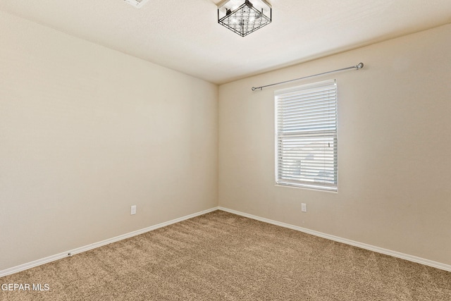 14840 Tim Hardaway, El Paso, TX 79938 - unfurnished room with light carpet and baseboards