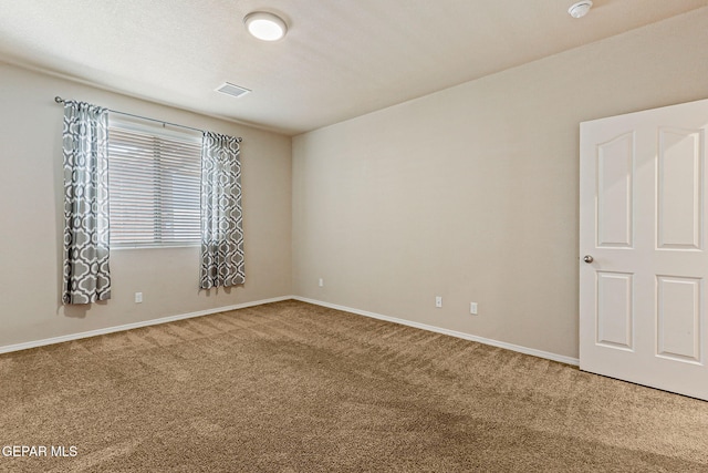 14840 Tim Hardaway, El Paso, TX 79938 - empty room with carpet, baseboards, and a smoke detector