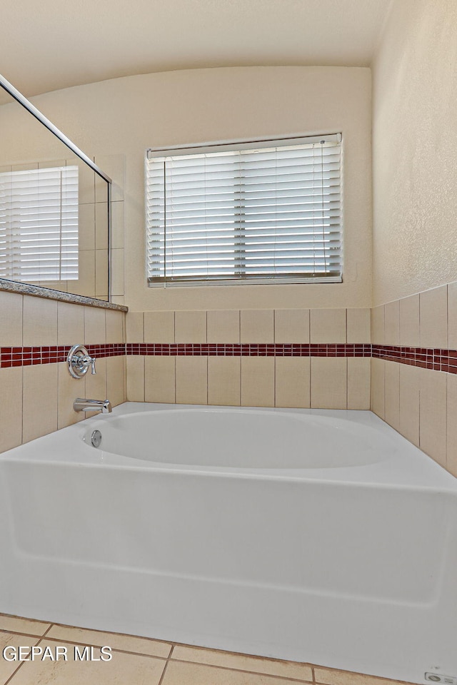 14840 Tim Hardaway, El Paso, TX 79938 - full bath with a garden tub and tile patterned flooring