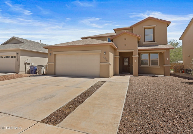 14840 Tim Hardaway, El Paso, TX 79938 - view of front facade featuring a garage, stucco siding, and concrete driveway