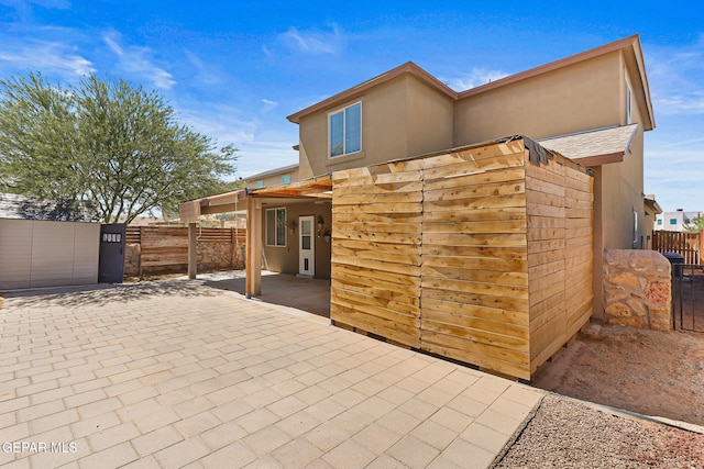 14840 Tim Hardaway, El Paso, TX 79938 - rear view of property featuring a patio area and stucco siding