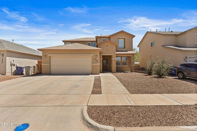 14840 Tim Hardaway, El Paso, TX 79938 - view of front facade with a garage, stucco siding, and driveway