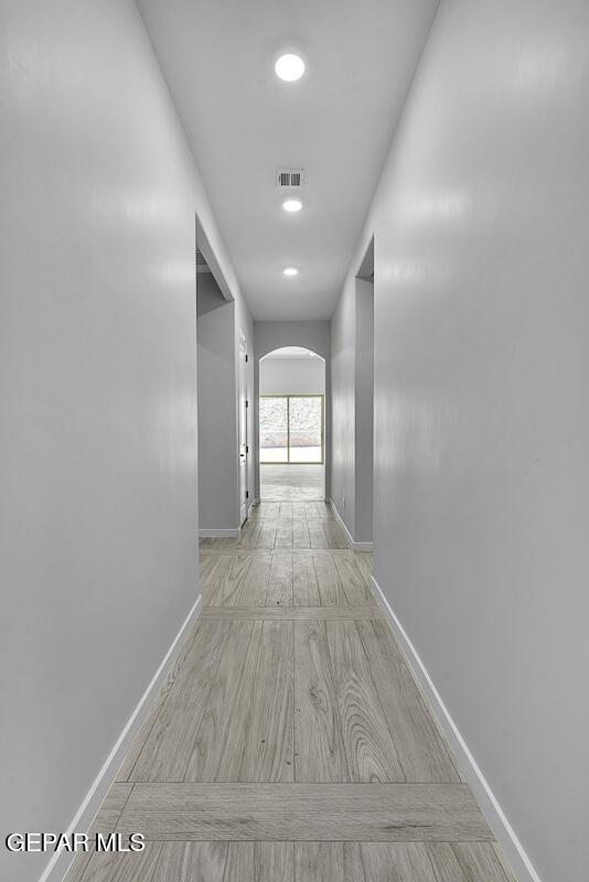 248 Emerald Storm Pl, El Paso, TX 79928 - corridor featuring arched walkways and baseboards
