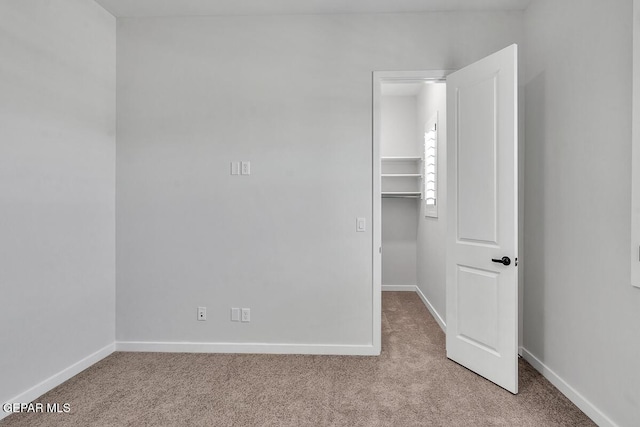 248 Emerald Storm Pl, El Paso, TX 79928 - unfurnished bedroom featuring carpet, a spacious closet, baseboards, and a closet
