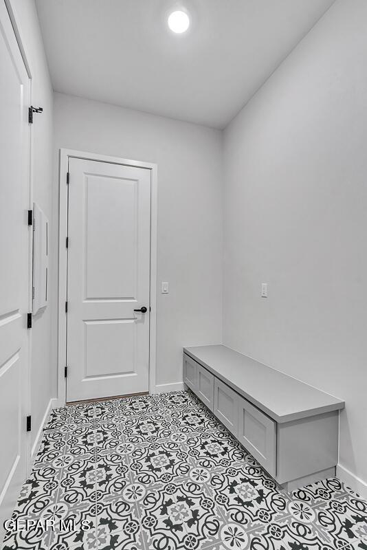 248 Emerald Storm Pl, El Paso, TX 79928 - mudroom with baseboards and tile patterned flooring