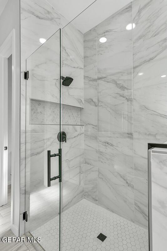 248 Emerald Storm Pl, El Paso, TX 79928 - full bathroom featuring a marble finish shower