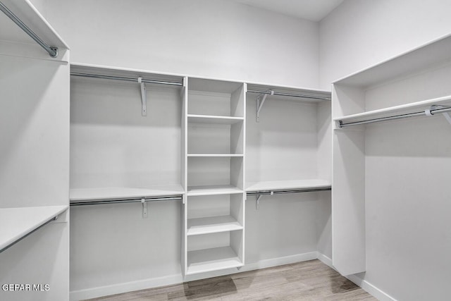 248 Emerald Storm Pl, El Paso, TX 79928 - spacious closet featuring wood finished floors