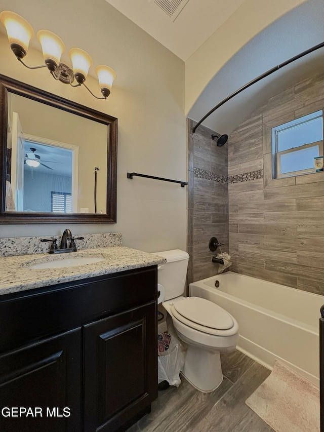 12217 Chapel Hill Rd, El Paso, TX 79928 - full bathroom featuring wood finished floors, vanity, and shower / bath combination