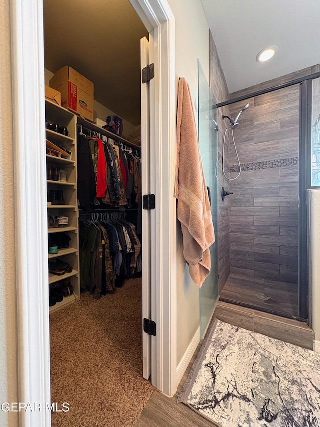 12217 Chapel Hill Rd, El Paso, TX 79928 - bathroom featuring a shower stall, a walk in closet, and recessed lighting