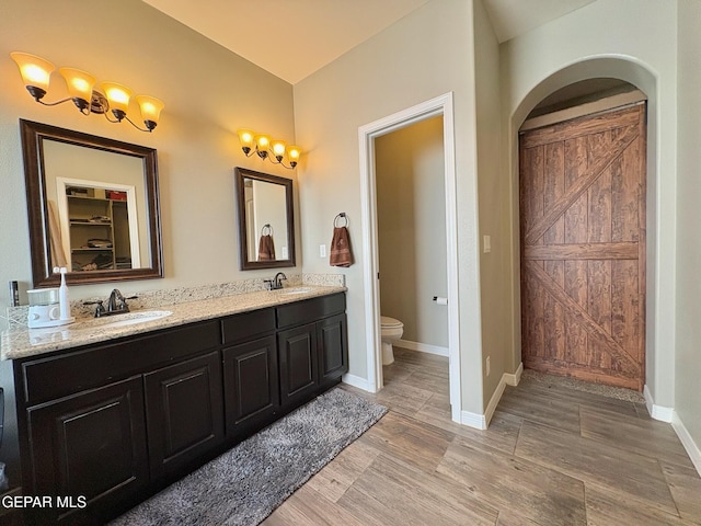 12217 Chapel Hill Rd, El Paso, TX 79928 - full bath featuring double vanity, a closet, and wood finished floors