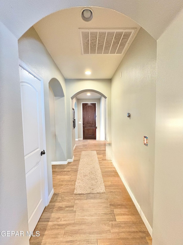 12217 Chapel Hill Rd, El Paso, TX 79928 - hall with arched walkways, light wood-style floors, and recessed lighting