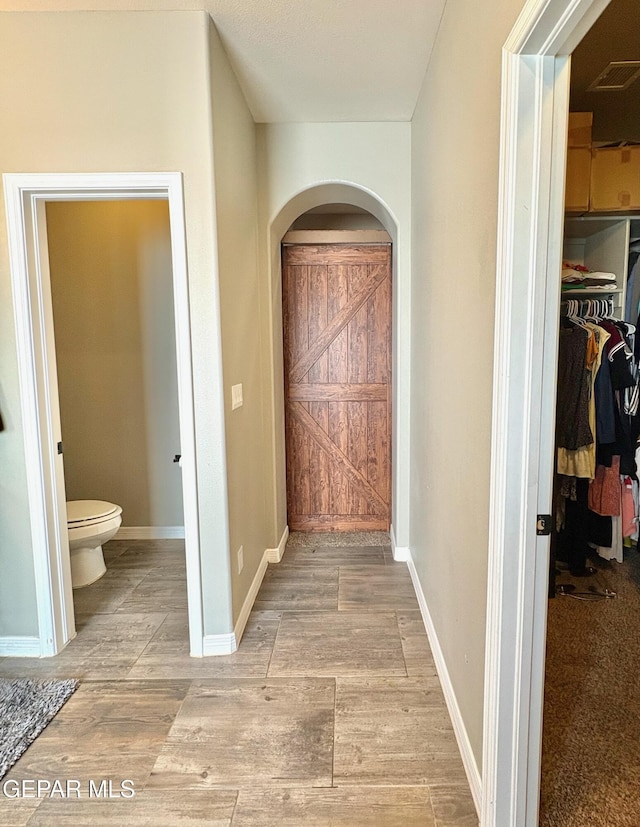 12217 Chapel Hill Rd, El Paso, TX 79928 - hall featuring arched walkways and light wood-type flooring