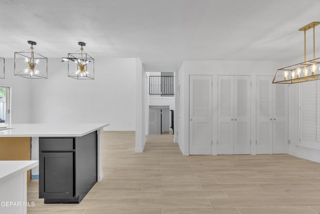 1460 Backus St, El Paso, TX 79925 - unfurnished dining area with a chandelier and light wood-style floors