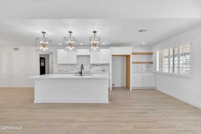 1460 Backus St, El Paso, TX 79925 - kitchen with a sink, tasteful backsplash, white cabinets, light countertops, and recessed lighting