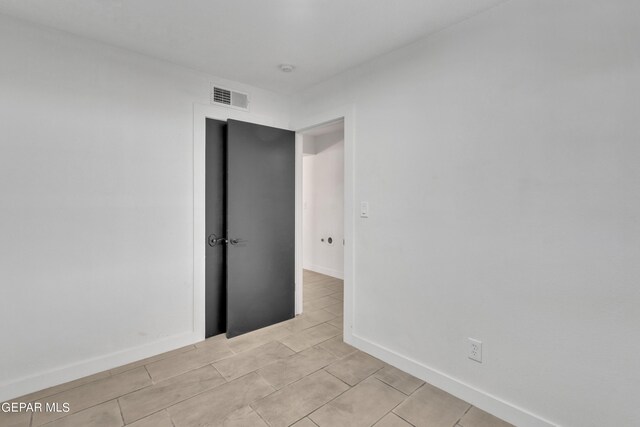 1460 Backus St, El Paso, TX 79925 - spare room with light tile patterned floors and baseboards