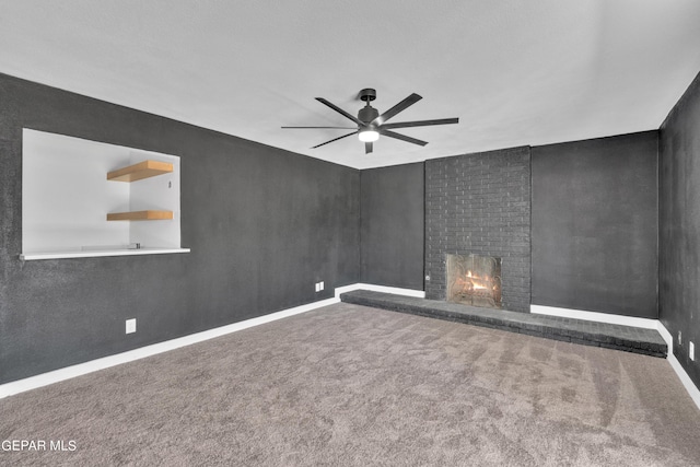1460 Backus St, El Paso, TX 79925 - unfurnished living room with ceiling fan, a brick fireplace, carpet flooring, and baseboards