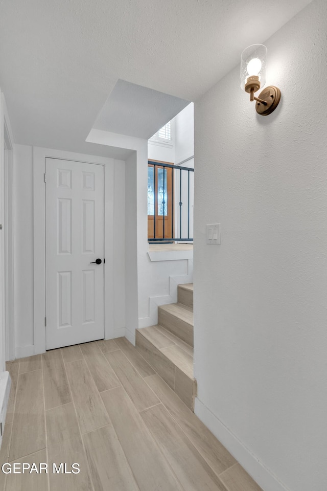 1460 Backus St, El Paso, TX 79925 - stairs with wood tiled floors and baseboards