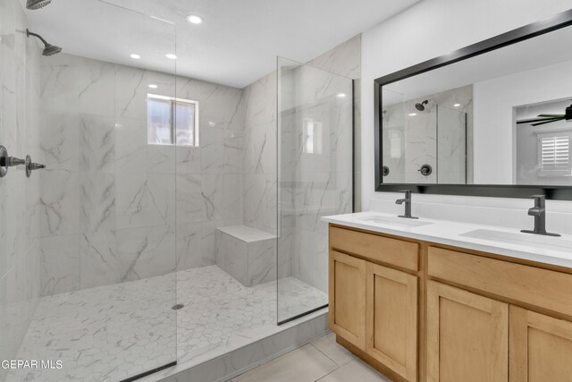 1460 Backus St, El Paso, TX 79925 - bathroom featuring a marble finish shower, double vanity, and tile patterned floors