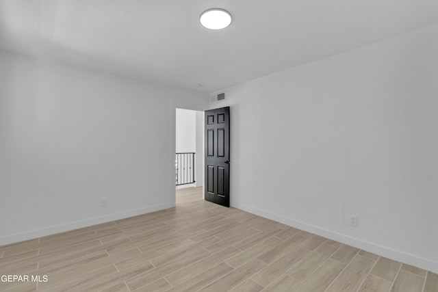 1460 Backus St, El Paso, TX 79925 - spare room with light wood-type flooring and baseboards