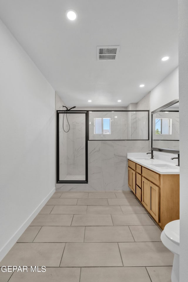 1460 Backus St, El Paso, TX 79925 - full bathroom with toilet, a marble finish shower, double vanity, and recessed lighting