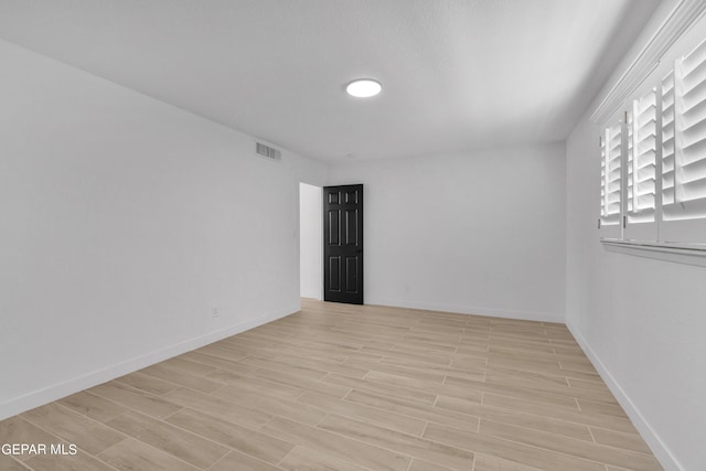 1460 Backus St, El Paso, TX 79925 - spare room featuring light wood-style flooring and baseboards