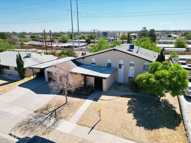 1460 Backus St, El Paso, TX 79925 - view of front of home featuring concrete driveway and an attached carport
