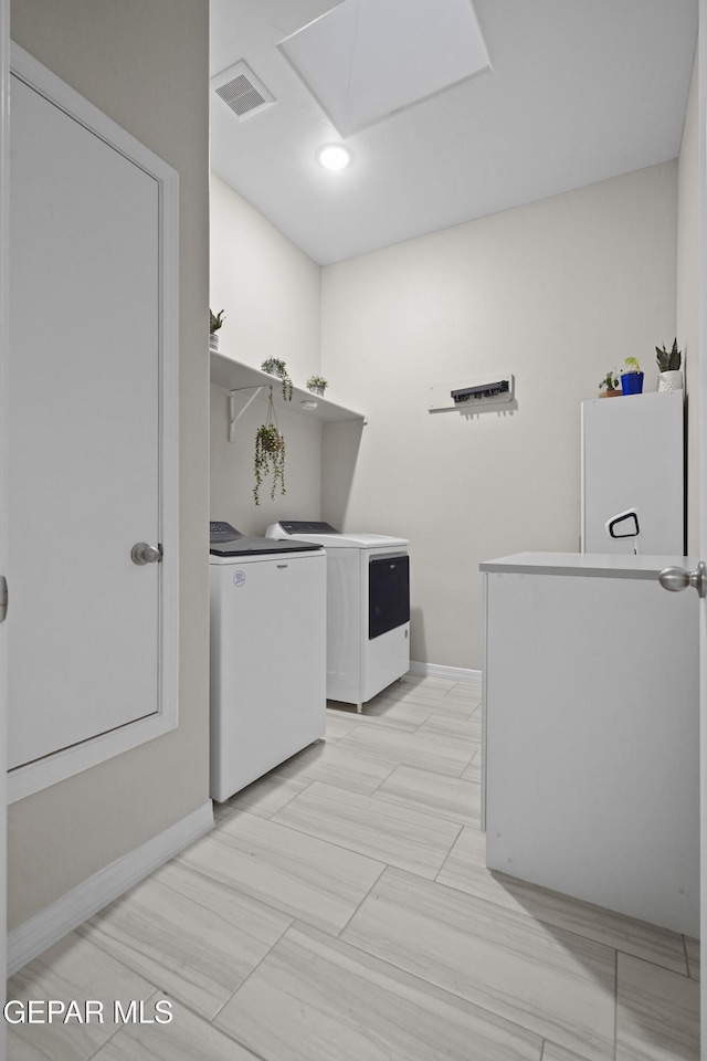 2305 Enchanted Quail, El Paso, TX 79911 - laundry area with washer and dryer and baseboards