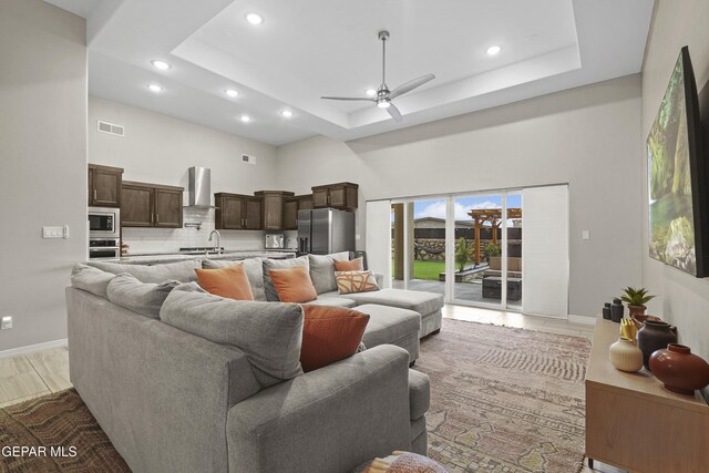 2305 Enchanted Quail, El Paso, TX 79911 - living area with recessed lighting, ceiling fan, a towering ceiling, and a raised ceiling