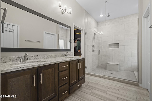2305 Enchanted Quail, El Paso, TX 79911 - bathroom with a shower stall and double vanity