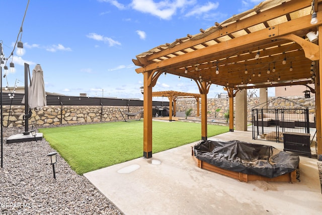 2305 Enchanted Quail, El Paso, TX 79911 - fenced backyard with an outdoor fire pit, a pergola, and a patio area
