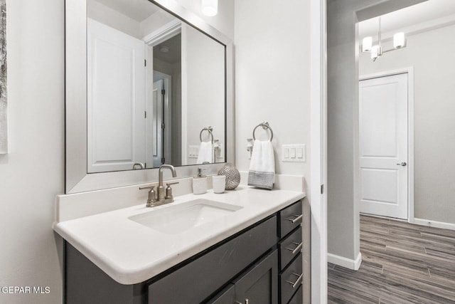 912 Pettus Pl, El Paso, TX 79928 - bathroom featuring vanity, baseboards, and wood finished floors