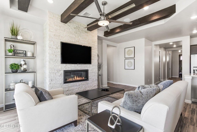 912 Pettus Pl, El Paso, TX 79928 - living area featuring ceiling fan, a fireplace, wood finished floors, baseboards, and beamed ceiling