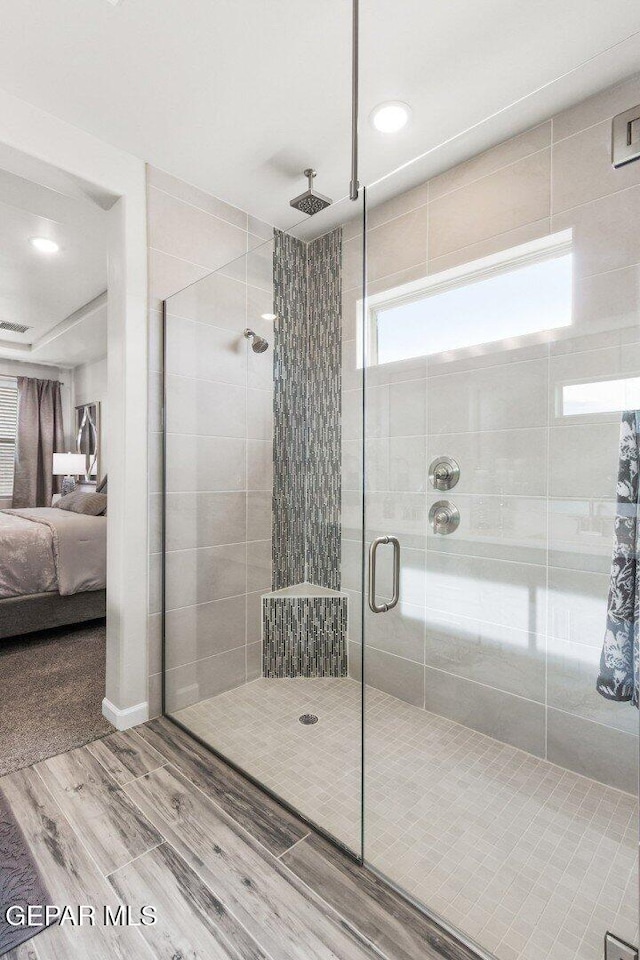 912 Pettus Pl, El Paso, TX 79928 - full bathroom featuring wood finished floors, connected bathroom, a stall shower, and recessed lighting