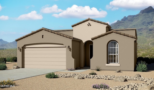 912 Pettus Pl, El Paso, TX 79928 - mediterranean / spanish-style home with a mountain view, an attached garage, driveway, a tiled roof, and stucco siding