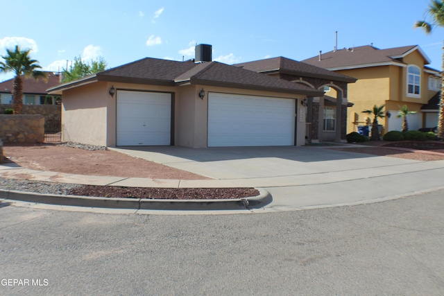 1429 Jettie Ray Way, El Paso, TX 79936 - view of front of property featuring stucco siding, an attached garage, driveway, and central air condition unit