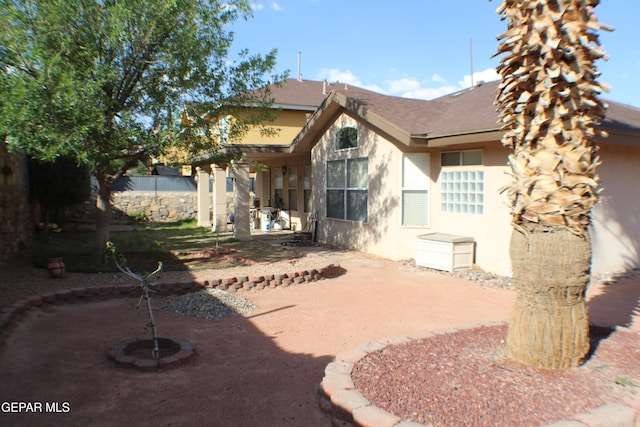 1429 Jettie Ray Way, El Paso, TX 79936 - rear view of property featuring stucco siding