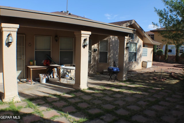1429 Jettie Ray Way, El Paso, TX 79936 - rear view of house featuring stucco siding and a patio
