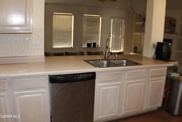 1429 Jettie Ray Way, El Paso, TX 79936 - kitchen with dishwasher, a sink, white cabinets, and light countertops