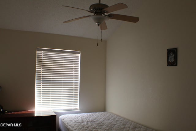 1429 Jettie Ray Way, El Paso, TX 79936 - bedroom featuring lofted ceiling, multiple windows, and a ceiling fan
