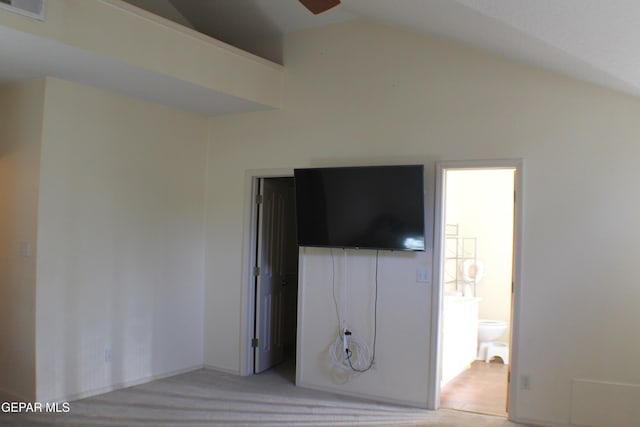 1429 Jettie Ray Way, El Paso, TX 79936 - unfurnished bedroom featuring lofted ceiling, ensuite bathroom, and light colored carpet
