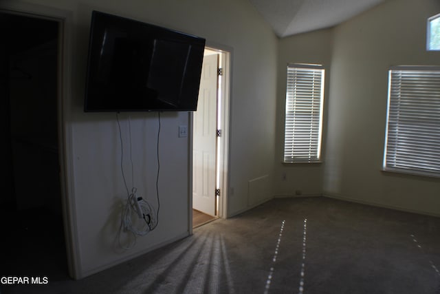 1429 Jettie Ray Way, El Paso, TX 79936 - unfurnished bedroom with lofted ceiling, carpet flooring, and baseboards