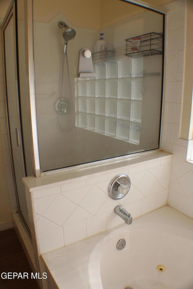 1429 Jettie Ray Way, El Paso, TX 79936 - full bath with a stall shower and a jetted tub