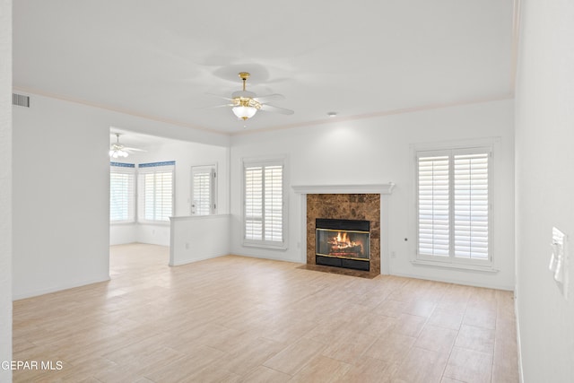 908 Via De La Paz Dr, El Paso, TX 79912 - unfurnished living room with ceiling fan, a fireplace, ornamental molding, light wood finished floors, and baseboards