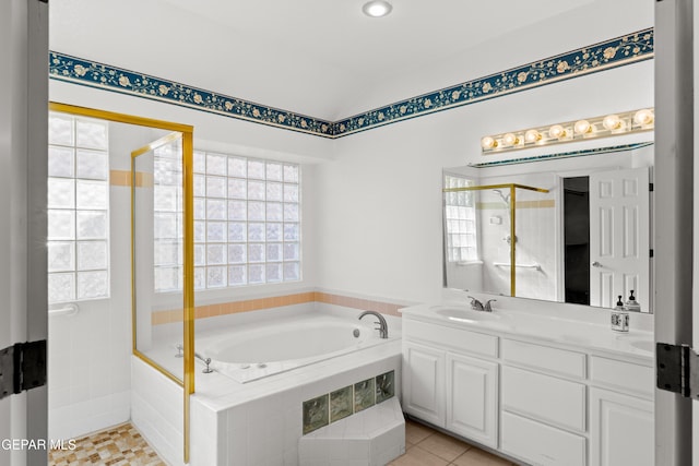 908 Via De La Paz Dr, El Paso, TX 79912 - full bath featuring a garden tub, a stall shower, lofted ceiling, double vanity, and tile patterned flooring