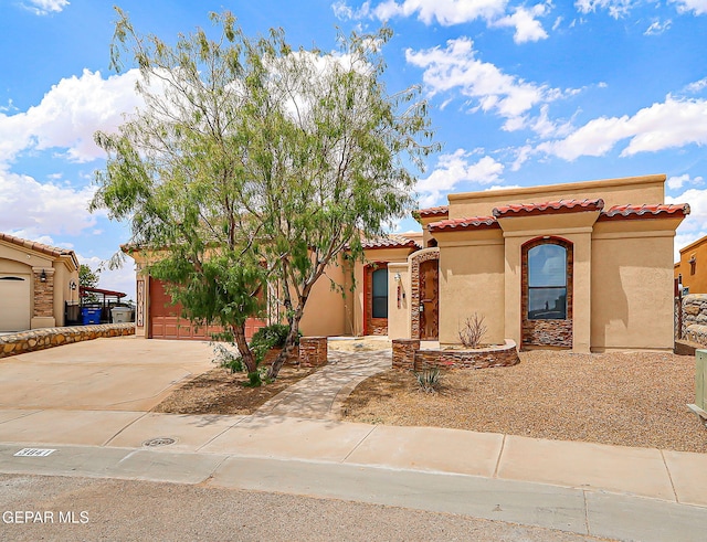 3841 Tierra Campa Dr, El Paso, TX 79938 - mediterranean / spanish house with driveway, stucco siding, a tile roof, and an attached garage