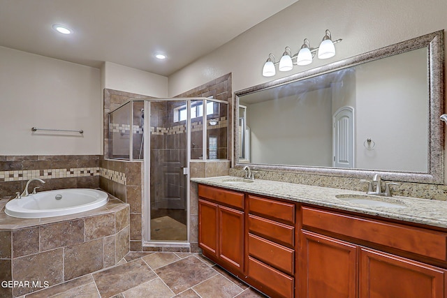 3841 Tierra Campa Dr, El Paso, TX 79938 - full bath featuring a garden tub, double vanity, a shower stall, and recessed lighting