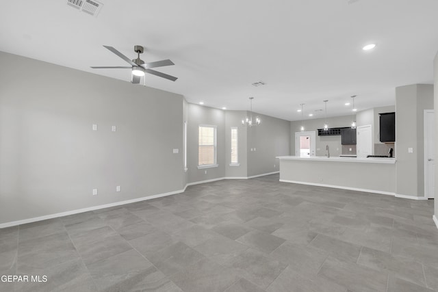 13845 Summer Wave Ave, El Paso, TX 79928 - unfurnished living room featuring a chandelier, a sink, recessed lighting, ceiling fan, and baseboards